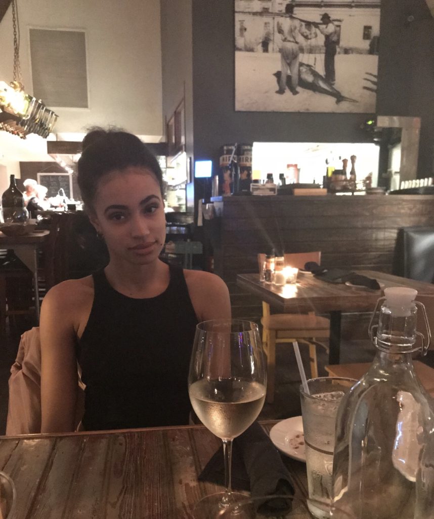 A girl with white wine